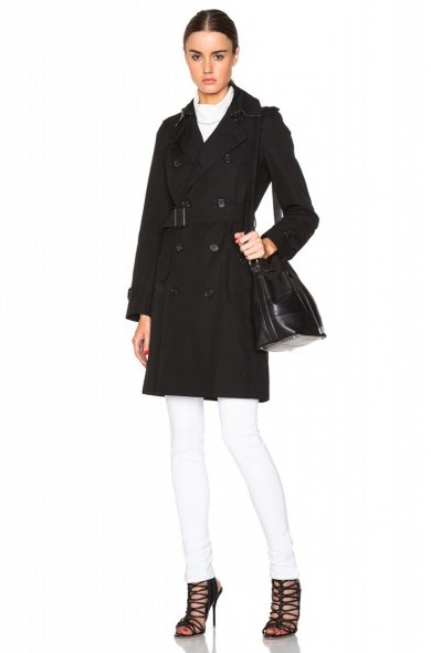 As worn by Angelina Jolie out in London’s West End, 5 September 2015…Burberry London Kensington Trench in black from fwrd.com. Casual celebrity fashion | star style | designer coats | what celebrities wear - flipped