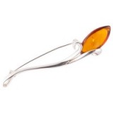 Long and slender cognac amber and sterling silver iris shaped brooch by amber specialists Be-Jewelled. Elegant brooches – jewellery