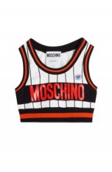 Rita Ora was spotted wearing one of these Moschino logo crop tops, out in New York, teamed with black, ripped skinny jeans, wide tan belt, strappy heels & a fedora hat…what a great look! September 2015. Celebrity fashion | what celebrities wear | cropped tops | designer fashion