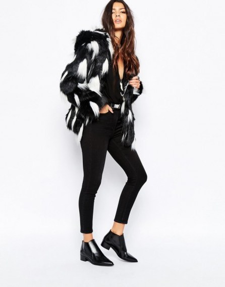Faux London fluffy faux fur hooded coat in black. Autumn – winter coats / womens outerwear / on-trend fashion - flipped