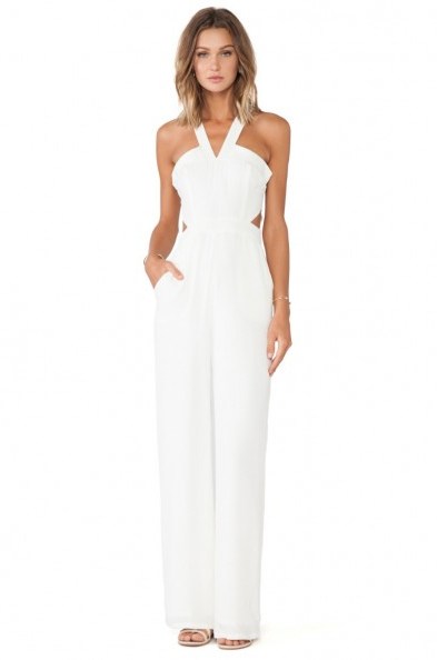 This Lovers + Friends ivory jumpsuit was worn by Olivia Palermo in July 2015, for a trip to East Hampton from New York City…what a way to travel! What celebrities wear | star style | celebrity fashion | cut out jumpsuits - flipped