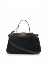 FENDI Micro Peekaboo shearling cross-body bag in black. Designer handbags | luxury bags | small shoulder bags