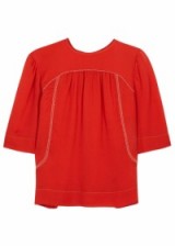 Katie Holmes was spotted in August wearing one of these bright red, embellished Isabel Marant tops while out in New York. It’s made of silk georgette and looks great with jeans. Midja top from harveynichols.com. Celebrity fashion | star style | womens sheer tops | blouses | what celebrities wear