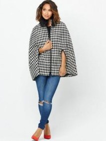 Myleene Klass Dogtooth Cape – as worn by Myleene Klass on the way to work in London, 18 September 2015. Celebrity fashion | star style | capes | womens coats | autumn jackets | what celebrities wear - flipped
