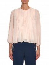 Worn with a pair of 70s style flares, this Chloe pleated silk blouse is perfect for creating a look of boho chic. Designer blouses | vintage style tops | bohemian looks | pale pink
