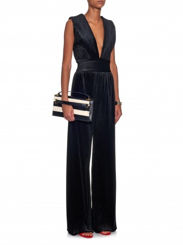 From the runway – BALMAIN Pleated velvet jumpsuit in black. Designer jumpsuits | occasion fashion | luxury evening wear | luxe style clothing | plunging neckline | deep V-necklines