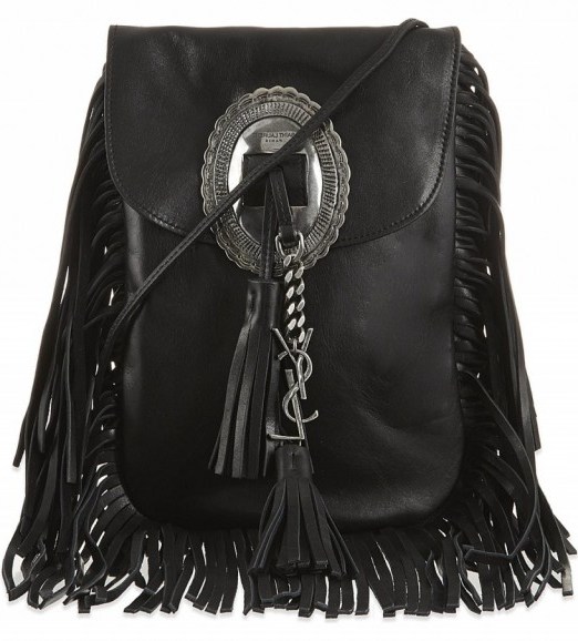 For the perfect boho chic look, want this Saint Laurent Anita tasselled flat bag in black…Kourtney Kardashian owns one in tan suede! Designer bags / fringed handbags / celeb style accessories - flipped
