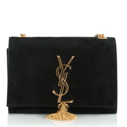 Spotted! Vanessa Hudgens carrying a Saint Laurent black suede monogram tassel cross-body bag, in Los Angeles, September 2015. Celebrity fashion | designer bags | star style