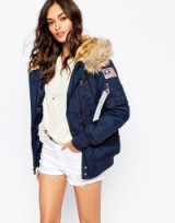 Alpha Industries Polar Hooded Bomber Jacket With Faux Fur Hood in navy. Warm winter jackets | womens casual outerwear | weekend fashion