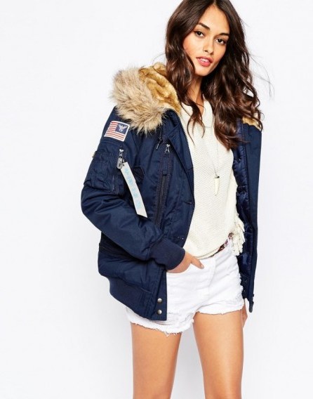 Alpha Industries Polar Hooded Bomber Jacket With Faux Fur Hood in navy. Warm winter jackets | womens casual outerwear | weekend fashion - flipped