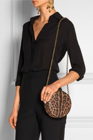 DOLCE & GABBANA Glam leopard-print faux leather shoulder bag. Animal prints – round bags – designer handbags – glamorous accessories