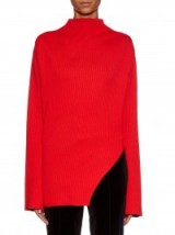 THOMAS TAIT Flared-sleeve ribbed-knit sweater in red. Designer knitwear | asymmetric jumpers | luxury sweaters | knitted fashion