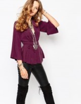 Free People Grand Piano Wrap Top with Peplum Detail in mulberry. Plunge neckline tops | waist tie blouses