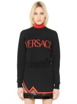 VERSACE LOGO PATCHED COTTON SWEATSHIRT with crew neck – as worn by Perrie Edwards on Instagram, 14 October 2015. Designer sweatshirts | celebrity fashion | star style | what celebrities wear | Little Mix clothing
