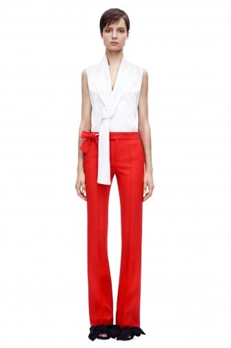 Victoria Beckham Flare Trouser red – as worn by Victoria Beckham at Lax airport, 26 October 2015. Celebrity fashion | star style | what celebrities wear | designer trousers - flipped