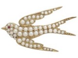 Victorian seed pearl and ruby 15ct yellow gold Swallow brooch. Bird brooches – antique jewellery