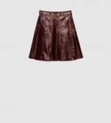 GUCCI – light patent dark brown leather pleated mini skirt with gold horsebit detail on the waist