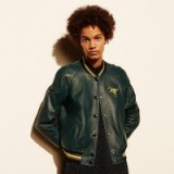 COACH ~ LEATHER t-rex varsity jacket in bottle green. Leather bomber jackets | embroidered dinosaur patch | casual fashion