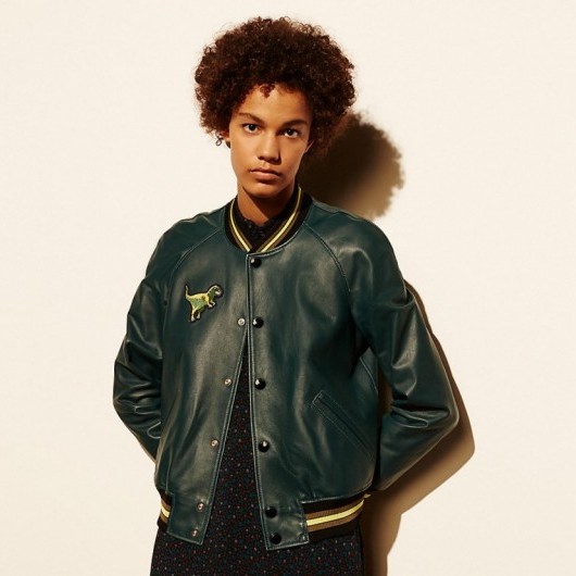 COACH ~ LEATHER t-rex varsity jacket in bottle green. Leather bomber jackets | embroidered dinosaur patch | casual fashion - flipped