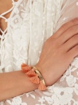 MARTE FRISNES Raquel gold-plated tassel cuff terracotta pink. Designer fashion jewellery | tassels | tasseled cuffs | bracelets | orange tones | summer accessories | holiday jewelry