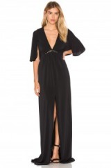 HALSTON HERITAGE FLOUNCE SLEEVE GOWN black. Plunge front gowns | deep V evening dresses | chic occasion wear | designer event fashion | empire line | maxi | plunging neckline