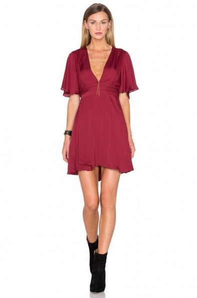 HOUSE OF HARLOW 1960 X REVOLVE HARPER WRAP DRESS in oxblood. Dark red dresses | plunge front fashion | flared ruffle short sleeves | silky fabric | deep V neckline | plunging necklines - flipped