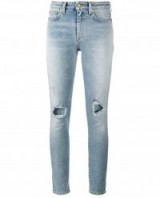 SAINT LAURENT Skinny Distressed Jeans. Faded blue denim | casual designer fashion | ripped style