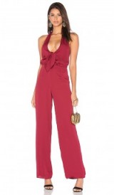 HOUSE OF HARLOW 1960 X REVOLVE COCO TIE FRONT JUMPSUIT oxblood. Plunge front jumpsuits | plunging neckline | glamorous evening wear | party fashion