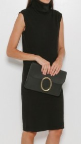 A Detacher ~ Lou black leather clutch bag with brass oval embellishment – large envelope bags – smart luxe handbags