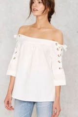 Nasty Gal Bare All White Off-the-Shoulder Top ~ bardo tops ~ on trend fashion ~ lace up sleeves
