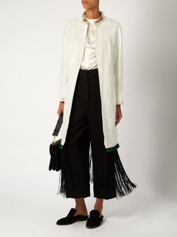 TOGA Fringe-trimmed velvet coat in white with long black fringing. Statement coats | designer outerwear | luxe Autumn fashion | chic clothing - flipped