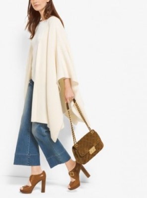 MICHAEL MICHAEL KORS Cream Shaker-Stitch Merino Wool-Blend Poncho. Stylish Autumn ponchos | knitted capes | fashion knitwear essential | outerwear essentials | wardrobe staple | classic coat cape - flipped