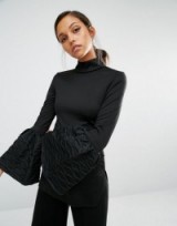 Asilio Loud Play Top in black. High neck tops | on-trend fashion | flared cuffs | bell sleeves | turtleneck