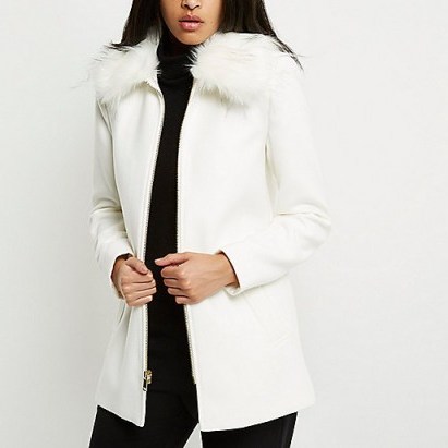 River Island white faux fur collar swing coat. Affordable luxe | winter coats | stylish outerwear | chic fashion - flipped