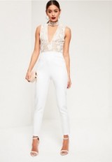 missguided white lace top choker sleeveless jumpsuit. Plunge front jumpsuits | going out fashion | evening and partywear | glamour | glamorous style | plunging neckline | deep V necklines