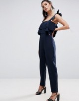 ASOS Jumpsuit with Double Ruffle and Contrast Grosgrain Tie in navy blue. Jumpsuits with style | on-trend fashion
