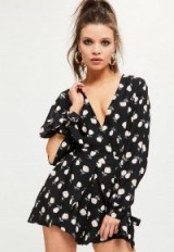 missguided black print split sleeve wrap playsuit. Plunge front playsuits | floral printed fashion | plunging neckline | slip sleeves | tie cuffs
