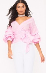 prettylittlething MARLOW BABY PINK OVERSIZED RUFFLE SLEEVE LOW SHOULDER SHIRT