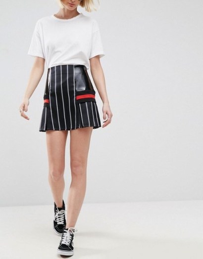 Jade Thirwall wore a black ASOS WHITE Pinstripe Skirt With Contrast Panels and a black ribbed funnel neck top, while attending the evian Live Young suite during Wimbledon 2017 at the All England Tennis and Croquet Club, 3 July 2017. Celebrity mini skirts | star style fashion - flipped