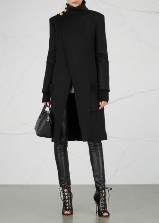 BALMAIN Black button-embellished wool coat – asymmetric front winter coats - flipped