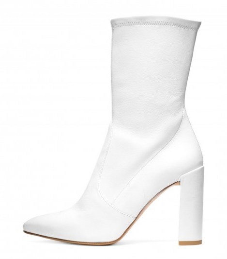 Bella Hadid white leather pointed toe ankle boots, Stuart Weitzman THE CLINGER BOOTIE, out in Paris during Haute Couture Fashion Week, 4 July 2017. Models off duty fashion | star style booties | celebrity footwear - flipped