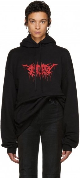 Hailey Baldwin hoody out in New York, Vetements Black Oversized Metal Logo Hoodie, 29 July 2017. - flipped