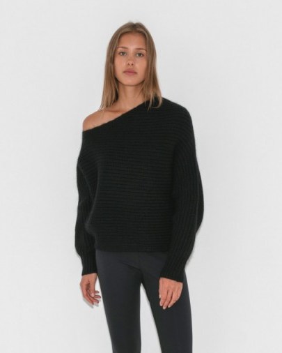Kourtney Kardashian black slouchy rib knit jumper, T by Alexander Wang Chunky Mohair Asymmetrical Sweater, out in Paris, 26 September 2017. Celebrity knitwear | star style sweaters - flipped