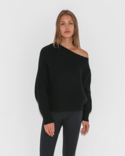 Kourtney Kardashian black slouchy rib knit jumper, T by Alexander Wang Chunky Mohair Asymmetrical Sweater, out in Paris, 26 September 2017. Celebrity knitwear | star style sweaters