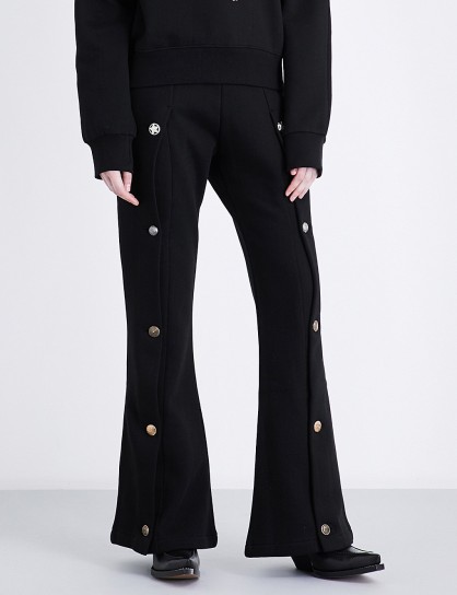 BLINDNESS Flared high-rise cotton-jersey jogging bottoms | black button embellished joggers