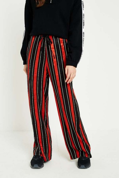UO Rust and Navy Striped Satin Puddle Trousers – stripe print pants