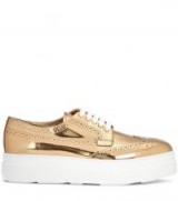 PRADA Metallic leather platform sneakers / shiny gold flatforms