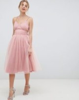 ASOS DESIGN Midi Tulle Prom Dress With Cut Out Sides And Bow | pink floaty fit and flare party dresses