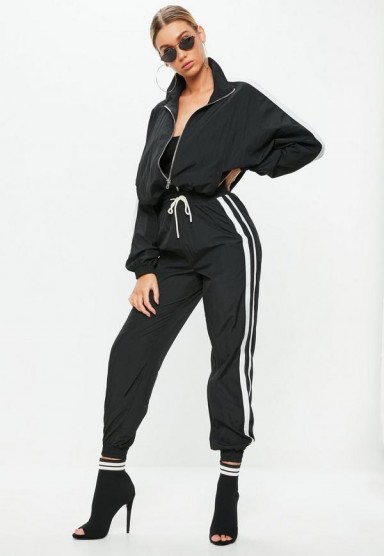 Missguided black double side stripe track shell suit trousers | sporty cuffed pants