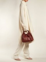 THE ROW Circle-handle leather bag / chic burgundy handbag